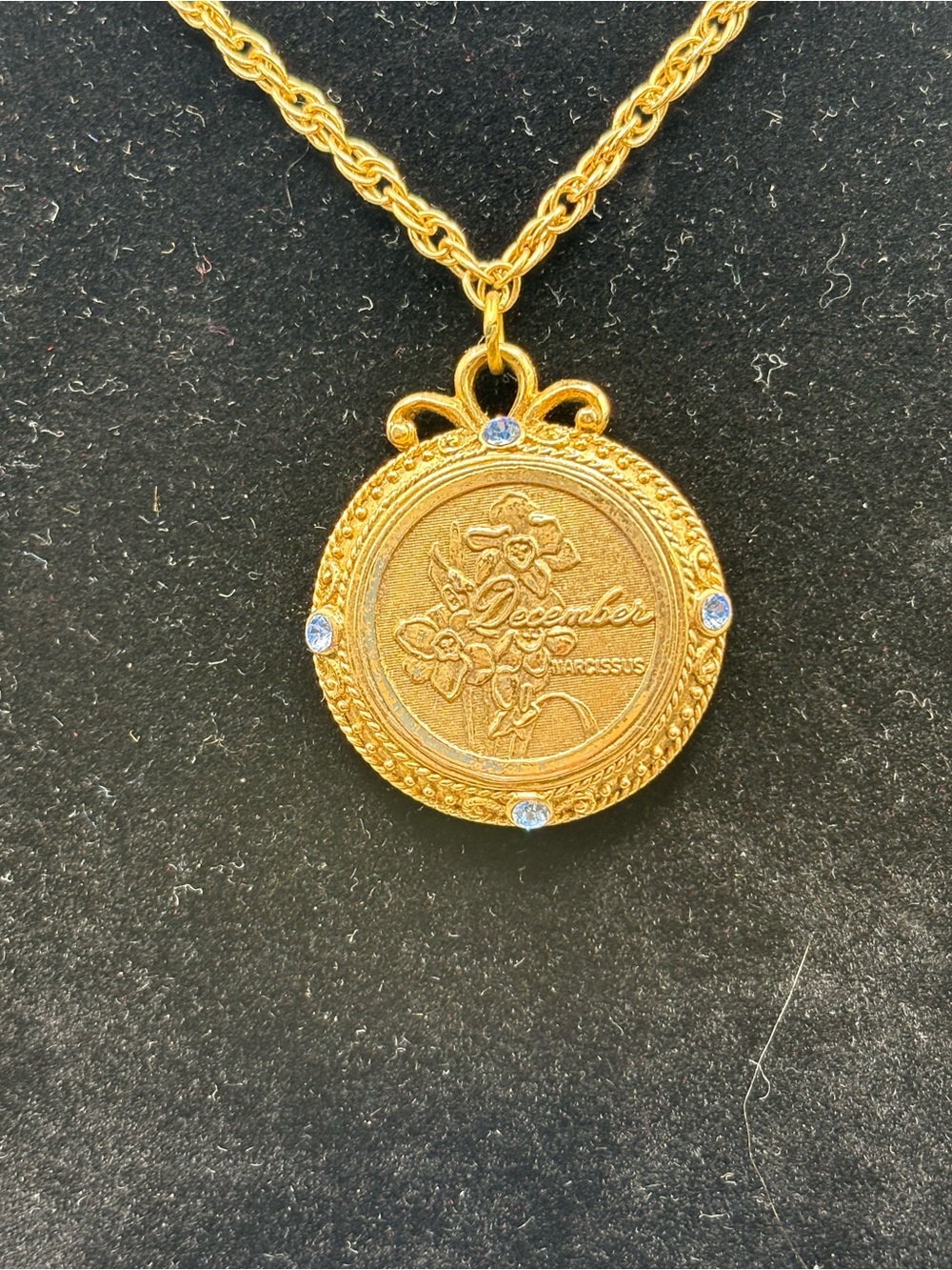 1928 Gold-Tone December Birthflower Pendant Necklace with light blue  Accents